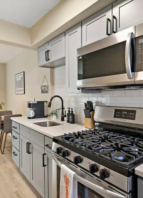 Full kitchen with granite island and stainless appliances
